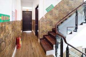 a staircase with a fire hydrant in front of a door at Hoàng Bách 3 Hotel in Ho Chi Minh City +9 photos