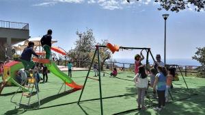 a group of people playing on a playground at Agriturismo Agri Armonia in San Lucido