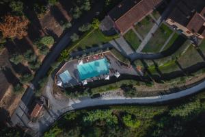 an overhead view of a yard with a pool at Borgo di Colleoli Resort in Colleoli +31 photos