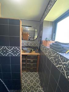 a bathroom with a sink and a mirror at La maison de Juliette in Céret +21 photos