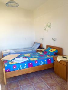 Postel nebo postele na pokoji v ubytování Dimitris Apartments