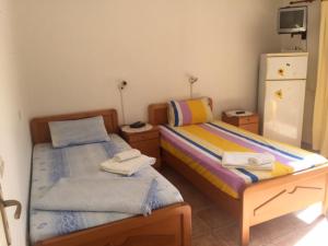 Postel nebo postele na pokoji v ubytování AVRA Apartments & Studios