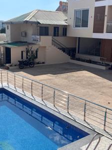 a view of a house with a swimming pool at Hotel Soham Retreat in Mahabaleshwar