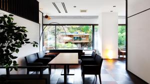 a dining room with a table and chairs at Premium Suites "Hanare Matsushimakaku" Produced by Shousuke no Yado Takinoyu in Aizuwakamatsu