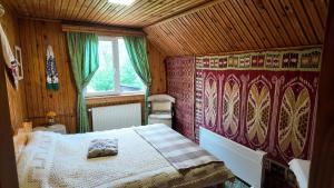 a bedroom with a large bed in a room at Casa Santa Maria Bran in Moieciu de Jos +40 photos