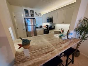 a kitchen with a wooden counter top in a room at Summerhouse 104- Direct Oceanfront condo in St. Augustine