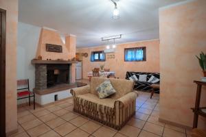 a living room with a couch and a fireplace at Residenza Su Prelau in Gonnesa