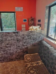 a living room with a counter and a couch at Kadaiya house in Marwad
