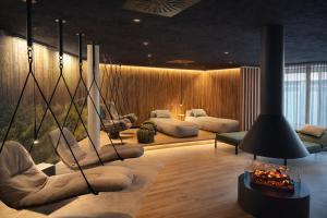 a living room with couches and chairs in a room at Mokni's Palais Hotel & SPA in Bad Wildbad