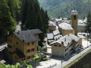 an aerial view of a town with a clock tower at Valdigiust in Campodolcino