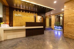 a lobby with a reception desk in a building at Hotel Seagull in Digha +83 photos