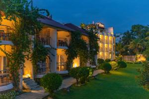 an exterior view of a building at night at Hotel Seagull in Digha