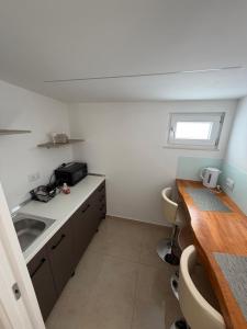 a small kitchen with a sink and a counter at Luxury Room Home Serpico in Scisciano