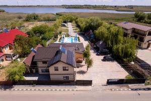 an aerial view of a house with a swimming pool at Casa din Delta in Murighiol