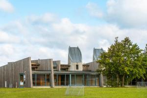 a building with two glass domes on top of it at Musholm Holiday, Sport & Conference in Korsør