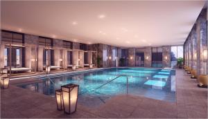 a swimming pool in a hotel with a lobby at Pullman Ninh Binh in Ninh Binh