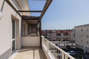 a balcony with a view of a city at Angelic Darsena Apartment in Ravenna