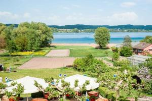 an aerial view of a park with a body of water at Insel-Hof Reichenau Hotel-garni in Reichenau