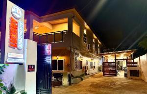 a building at night with the lights on at Accra Luxury Apartments At The Sanga Estates in Accra