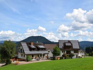 a house with solar panels on the side of it at Löcherhansenhof in Bad Peterstal-Griesbach