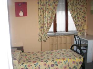 Postel nebo postele na pokoji v ubytování Albergo Sangrilà