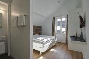 Letto o letti in una camera di Gasthof Eisenbahn