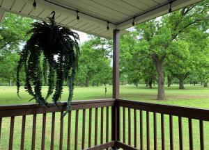 a porch with a wreath hanging on it with a park at GabyHill in Davis +45 photos