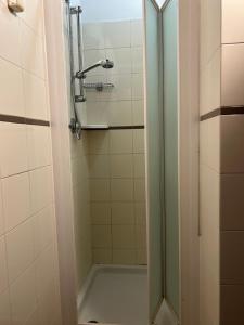 a shower with a glass door in a bathroom at Casa per Ferie Ulivo d'Assisi in Assisi