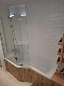a glass shower in a bathroom with a toilet at La Source in La Croix-Saint-Leufroy +15 photos
