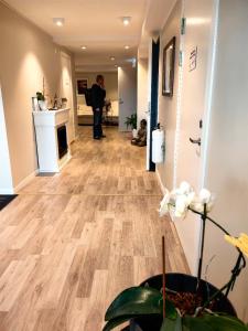 a man standing in the hallway of a house at Farm under the stars in Vallentuna