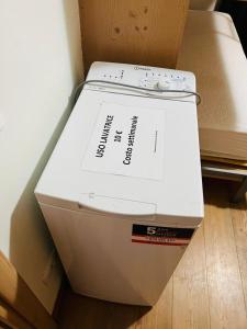 a white printer sitting on top of a box at Chalet Rin da Pemont in Livigno
