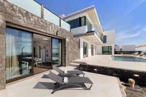 an image of a house with a swimming pool at Ocean View Lanzarote by Beyond in Tías