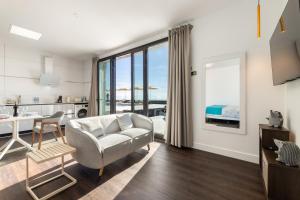 a living room with a couch and a table at Ocean View Lanzarote by Beyond in Tías