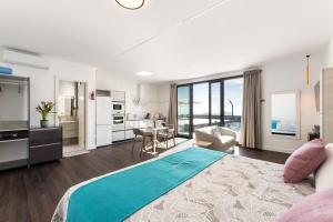 a large bedroom with a large bed and a kitchen at Ocean View Lanzarote by Beyond in Tías