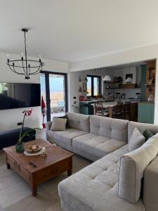 a living room with a couch and a table at Casa Elena in Banja Luka