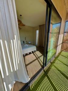 a view of a bedroom with a bed through a window at Villa Terra Akal in Essaouira +76 photos
