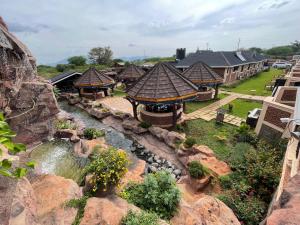 an aerial view of a resort with a river at Mawimbi Jiko Hotel in Taveta