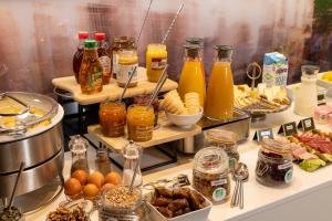 a buffet with many different types of food and drinks at Urban Bivouac Hotel in Paris