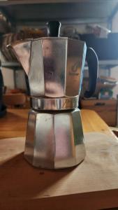 a metal blender sitting on top of a wooden table at Apartma Raft, Bovec in Bovec