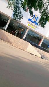 a building with a sign on the side of a street at فندق جولدن نيو روز بلازا جازان in Jazan