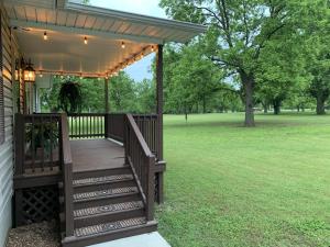 a wooden deck with a pergola on a house at GabyHill in Davis