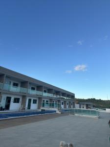 a large parking lot in front of a building at Condominio HOME DUPLEX SERRA NEGRA in Bezerros