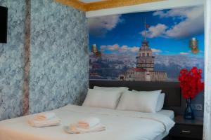 a bedroom with a bed with towels on it at Golden Horn Park Hotel in Istanbul