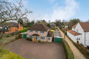 an aerial view of a house with a driveway at The Sweet Spot in Ickenham
