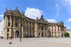 a large building with people walking in front of it at Hotel De Rome Berlin in Berlin +28 photos