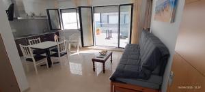 a living room with a couch and a table at Hotel Brisa del Mar in O Grove