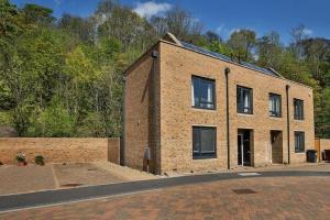 a brick building sitting on the side of a road at Beautiful City Centre House with Parking! Sleeps 6 in Sheffield