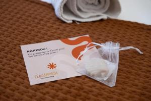 a bag of food sitting on top of a bed at T3 Elegance x Nawassi Moderne, climatisé, sécure in Pamandzi