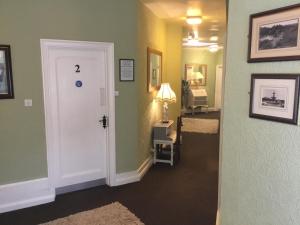 a hallway with a white door in a room at The Stockton Arms in Stockton-on-Tees +10 photos