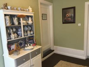 a room with a hutch filled with china at The Stockton Arms in Stockton-on-Tees